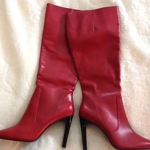 Gorgeous red zip up leather knee high boots.